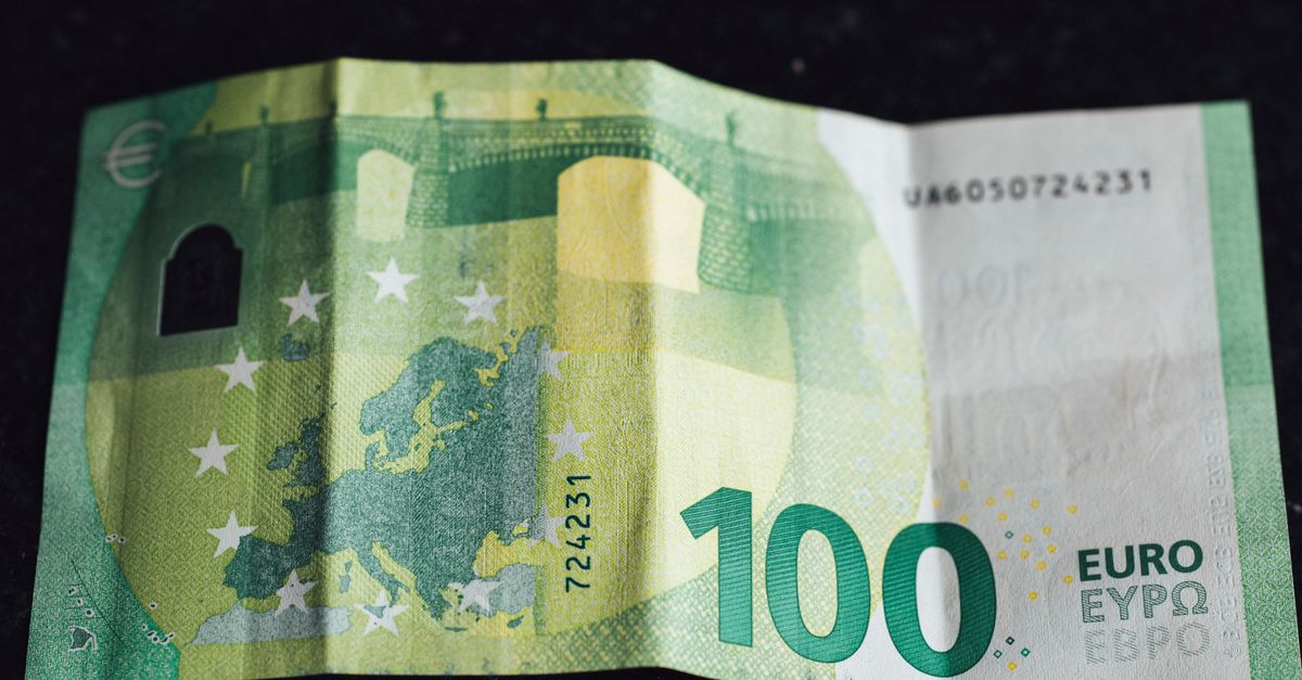 Close-up image of a 100 Euro banknote highlighting its design and details.